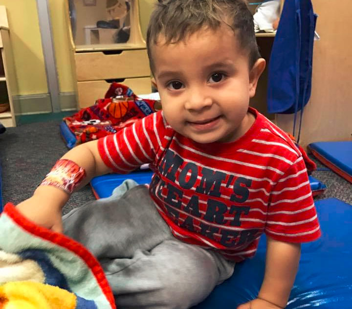 cute little toddler boy wearing red stripes shirt at A Preschool & daycare Serving Armona, CA