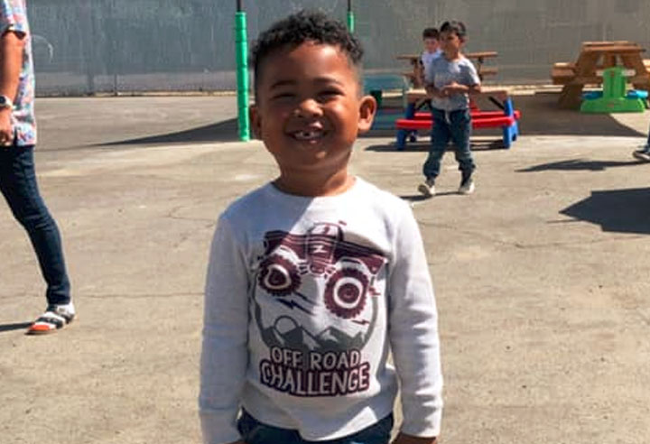 African american toddler boy smiling at A Preschool & daycare Serving Armona, CA